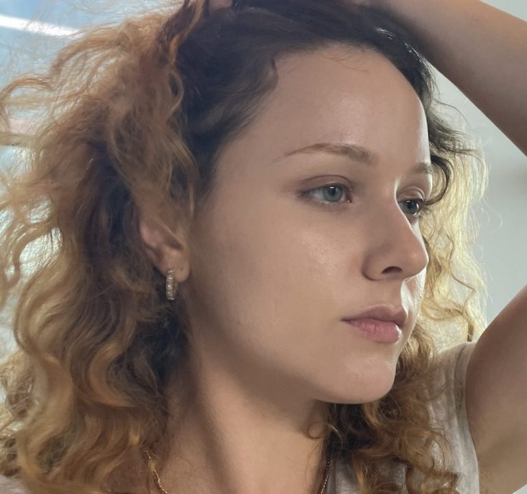 Close-up of Amber Ciociano's side profile, showing her clean skin.